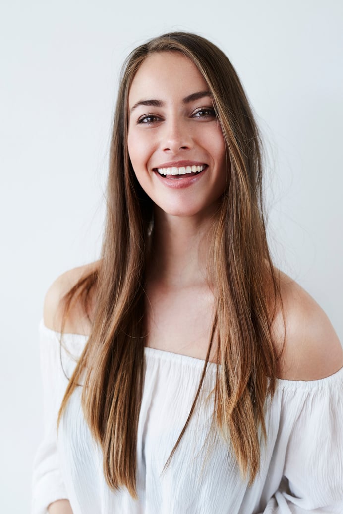 Portrait of gorgeous woman in white, smiling